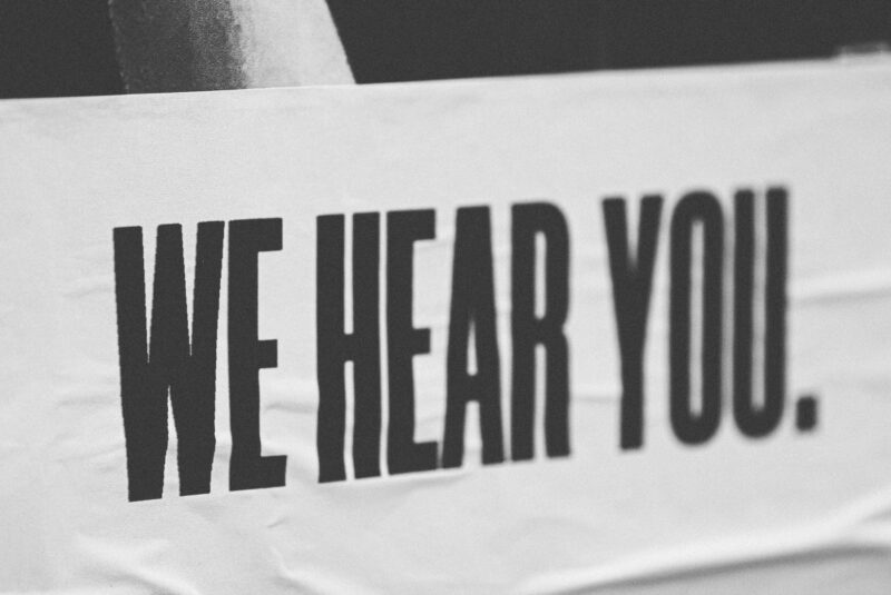 A sign that reads "we hear you"