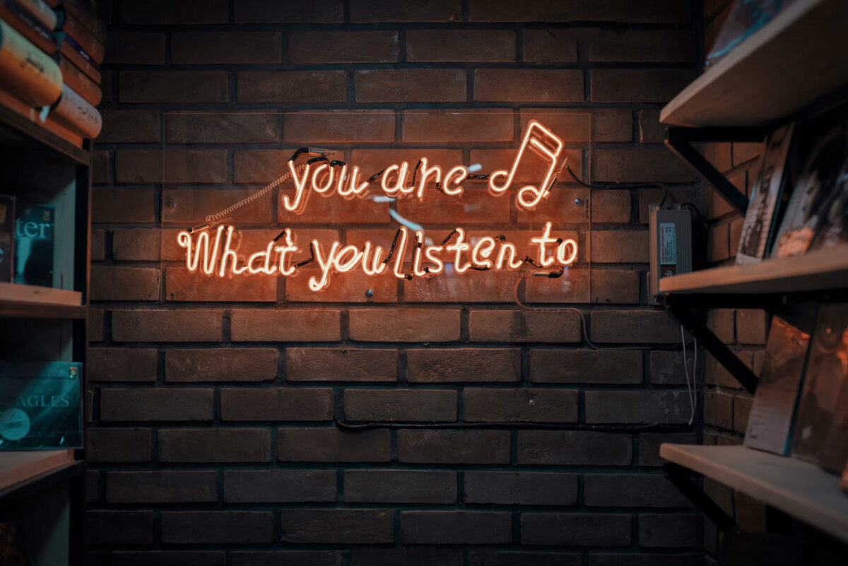 a neon sign that reads you are what you listen to