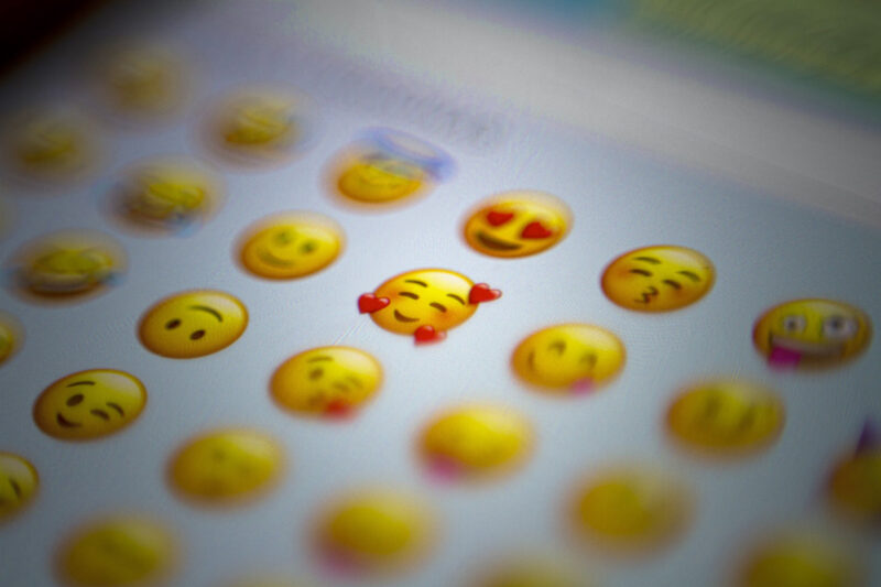 A screen with several smily faces and emojis